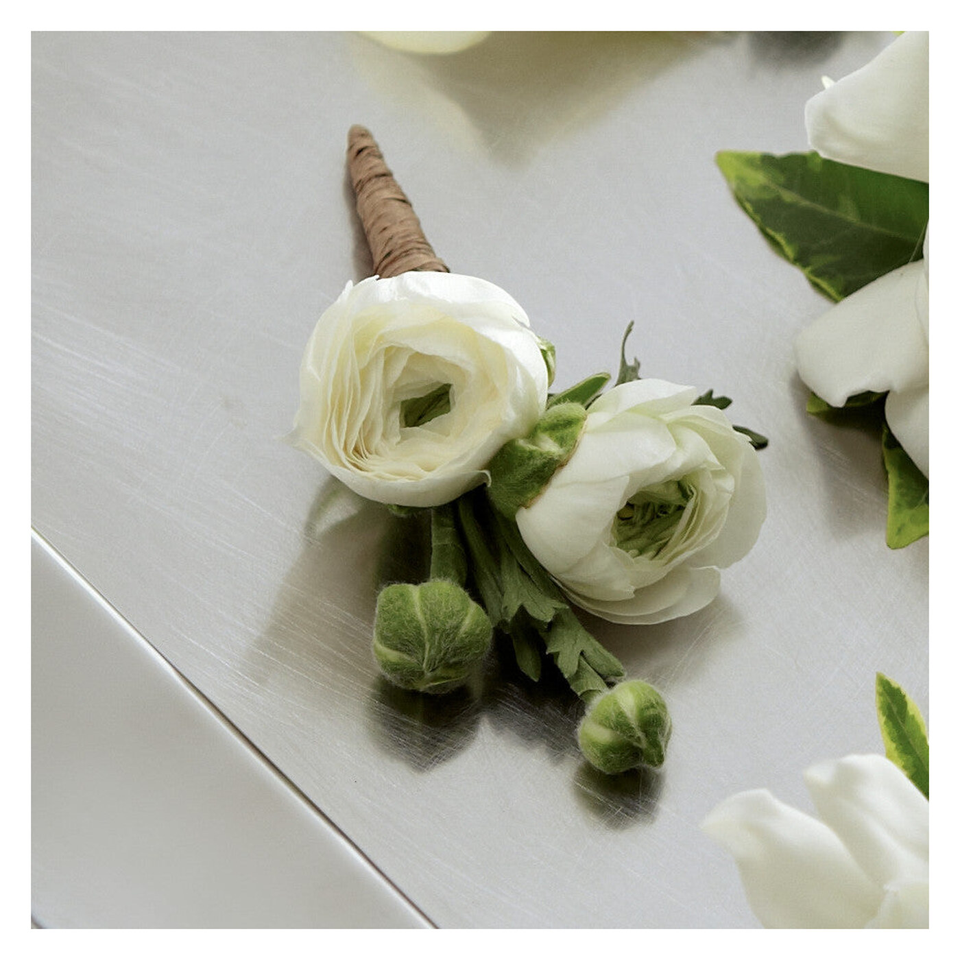White Ranunculus Boutonniere flower arrangement