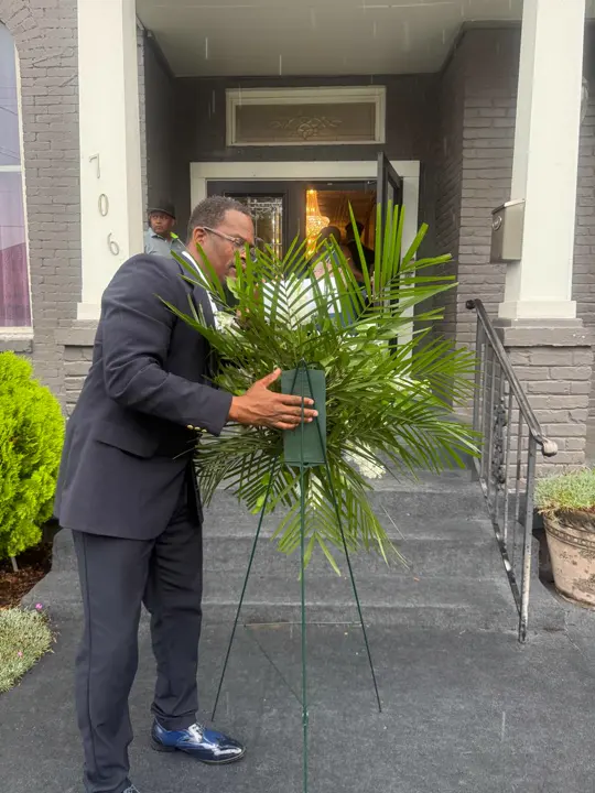 Funeral standing spray delivery setup at a Nashville-area home